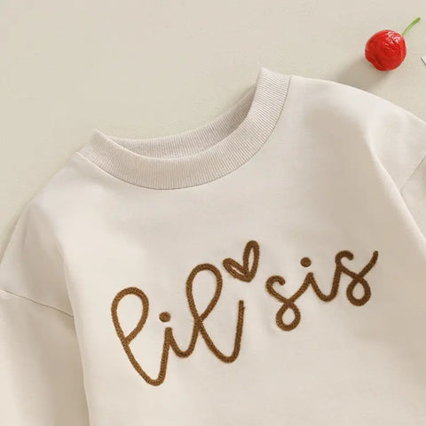 Passende Strampler und Pullover-Outfits für Schwestern mit Sister Logo und langen Ärmeln